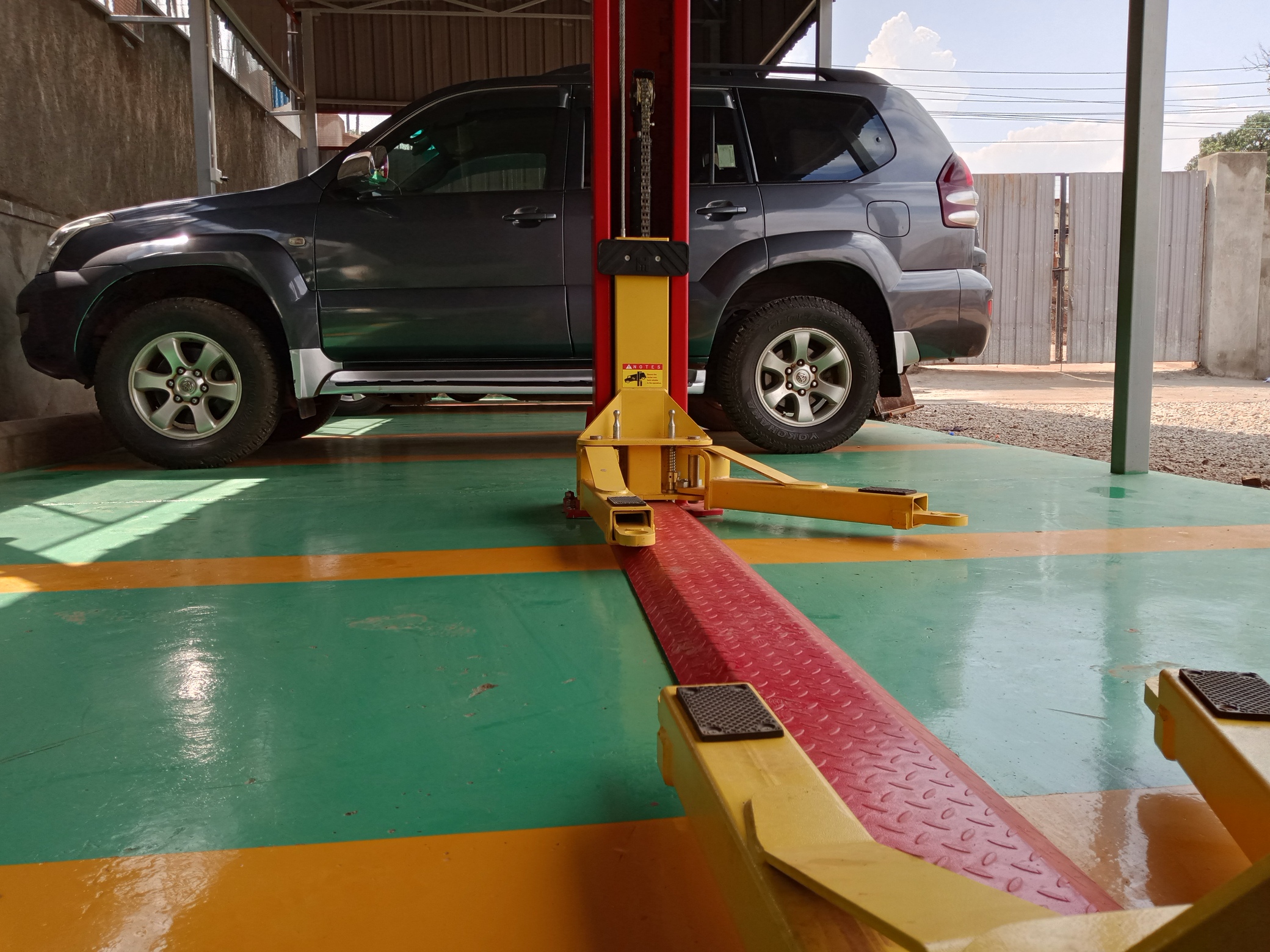 SUV raised on a lift for inspection